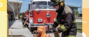 fireman connecting hose to hydrant